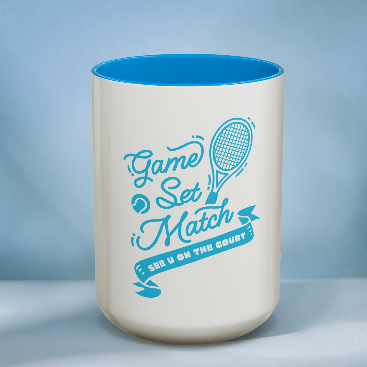 Mug with 'Game Set Match' text and tennis racket design on a blue background