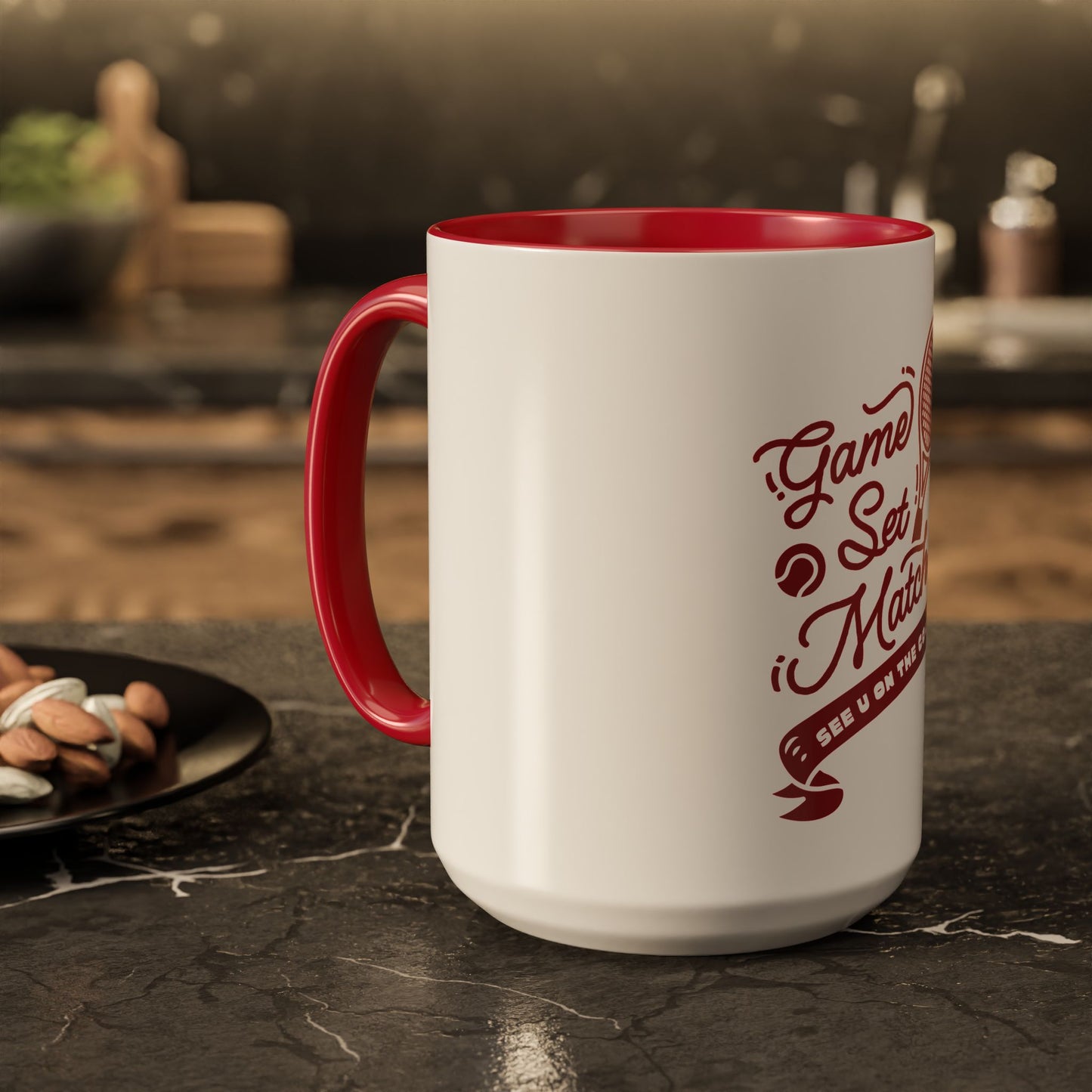 White mug with red interior and handle, featuring text on a dark surface.