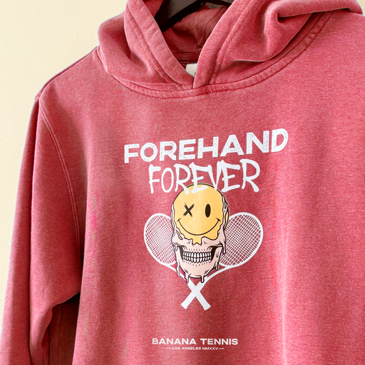 Red hoodie with 'Forehand Forever' graphic and 'Banana Tennis' branding on a beige background
