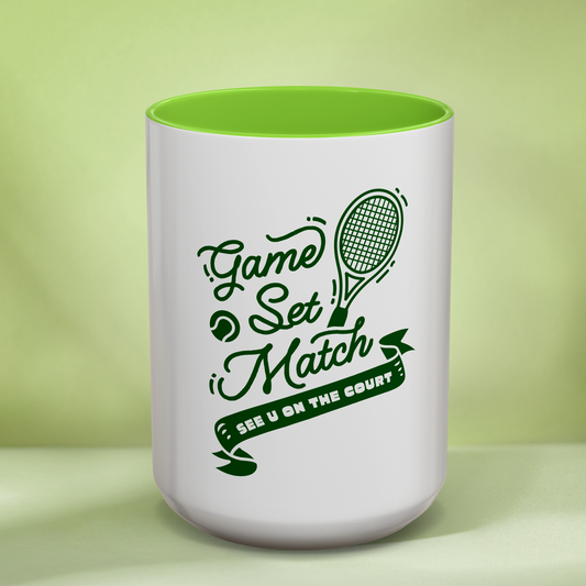 White mug with green interior and 'Game Set Match' text on a light green background