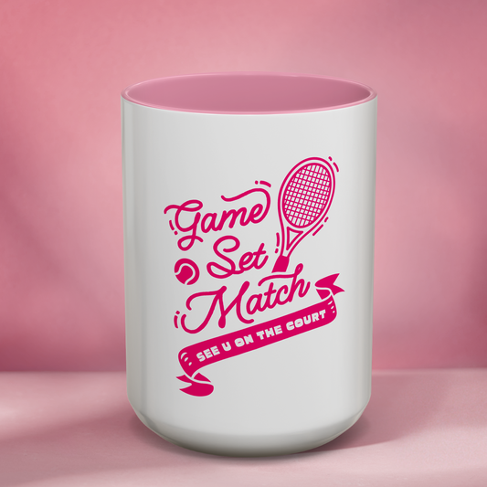White mug with pink interior, featuring a tennis-themed design on a pink background