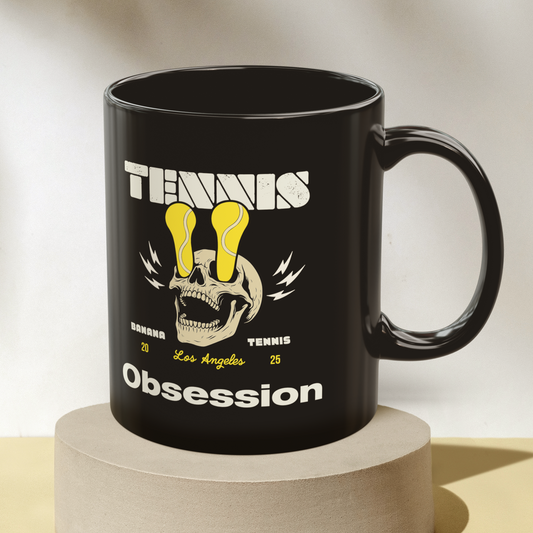 Black mug with graphic design on a beige background
